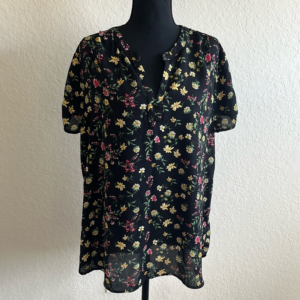 Black flowered blouse.